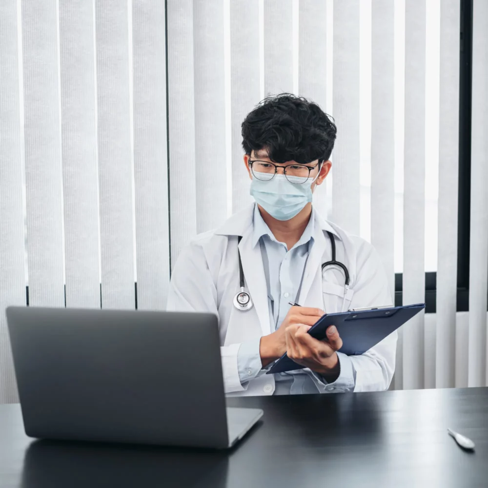 male-doctor-in-face-mask-medical-using-laptop-to-s-2023-11-27-05-09-30-utc (Custom) male-doctor-in-face-mask-medical-using-laptop-to-s-2023-11-27-05-09-30-utc (Custom)