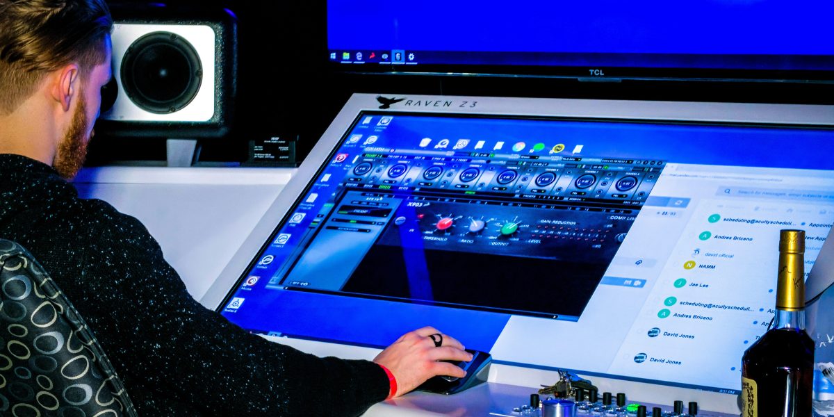 person in black long sleeve shirt playing game on computer